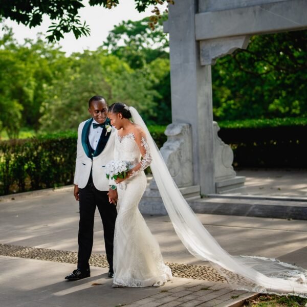 Modern off-shoulder mermaid wedding dress with a sheer corset bodice - Rebirth Couture Collection.