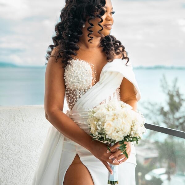 Minimalist satin bridal gown with high slit and halter neck - Bespoke Wedding Dresses.